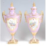 A pair of Lynton Porcelain Co pedestal vases and covers, each of classical urn shape, decorated in