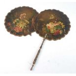 A pair of Victorian black lacquered papier-mâché face screens, each polychrome decorated with