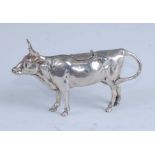 A circa 1900 German silver cow creamer, naturalistically modelled in standing pose, the hinged cover