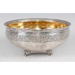 A Russian silver bowl, having a leaf and flower chased rim, gilt-washed interior, and further leaf