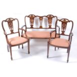 A Sheraton Revival mahogany and inlaid three-piece salon suite, circa 1900, comprising two-seater