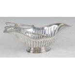 An Edwardian silver basket, of pierced elliptical form with swing carry handle and beaded rim, all