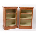 A pair of oak and burr oak open bookcases, each having crossbanded tops and adjustable shelves