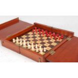 A circa 1900 mahogany travelling chess set, having fold-out action opening to reveal rosewood and