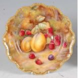 A Royal Worcester porcelain cabinet plate, decorated by Horace Price with fruit on a mossy bank,