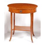 A circa 1900 satinwood two-tier occasional table, of oval form with crossbanded top, further