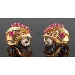 A pair of contemporary yellow metal, ruby and diamond set ear studs, each of leaf shape and set with