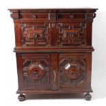 A Jacobean period and later geometric moulded oak chest, in two sections, the upper section with