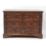 A Jacobean period oak chest, of three long geometric moulded drawers, having replacement turned