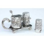 A circa 1900 Chinese white metal cruet set, of trefoil shape, containing an open salt, mustard (