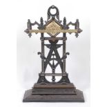 An Edwardian cast iron and brass stick-stand, w.47cm, h.73cm