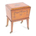 A fine quality Sheraton Revival painted satinwood workbox on stand, the box of sarcophagus form with