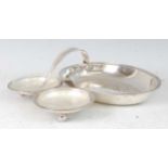A modern silver hors d'oeuvres dish by the Goldsmiths & Silversmiths Company, having a large oval