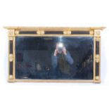 A circa 1830 giltwood and gesso overmantel mirror, the bevelled plate within a surround of leaf