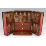 A circa 1830 mahogany travelling apothecary cabinet, the case with sunken brass carry handle over