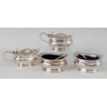 A Mappin & Webb silver four-piece cruet set, comprising a pair of boat shaped salts, with matching