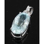 A white metal aquamarine single stone pendant, comprising an oval faceted aquamarine in a bezel