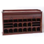 A Victorian mahogany tambour fronted desk top stationery cabinet, having a three-quarter gallery,