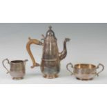 A George V silver three-piece coffee set, in the 18th century style, comprising a pear shaped coffee