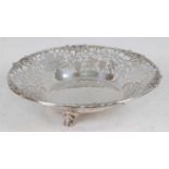 A mid-20th century silver footed bowl, the raised edge cast with fruiting vines over a vine leaf cut