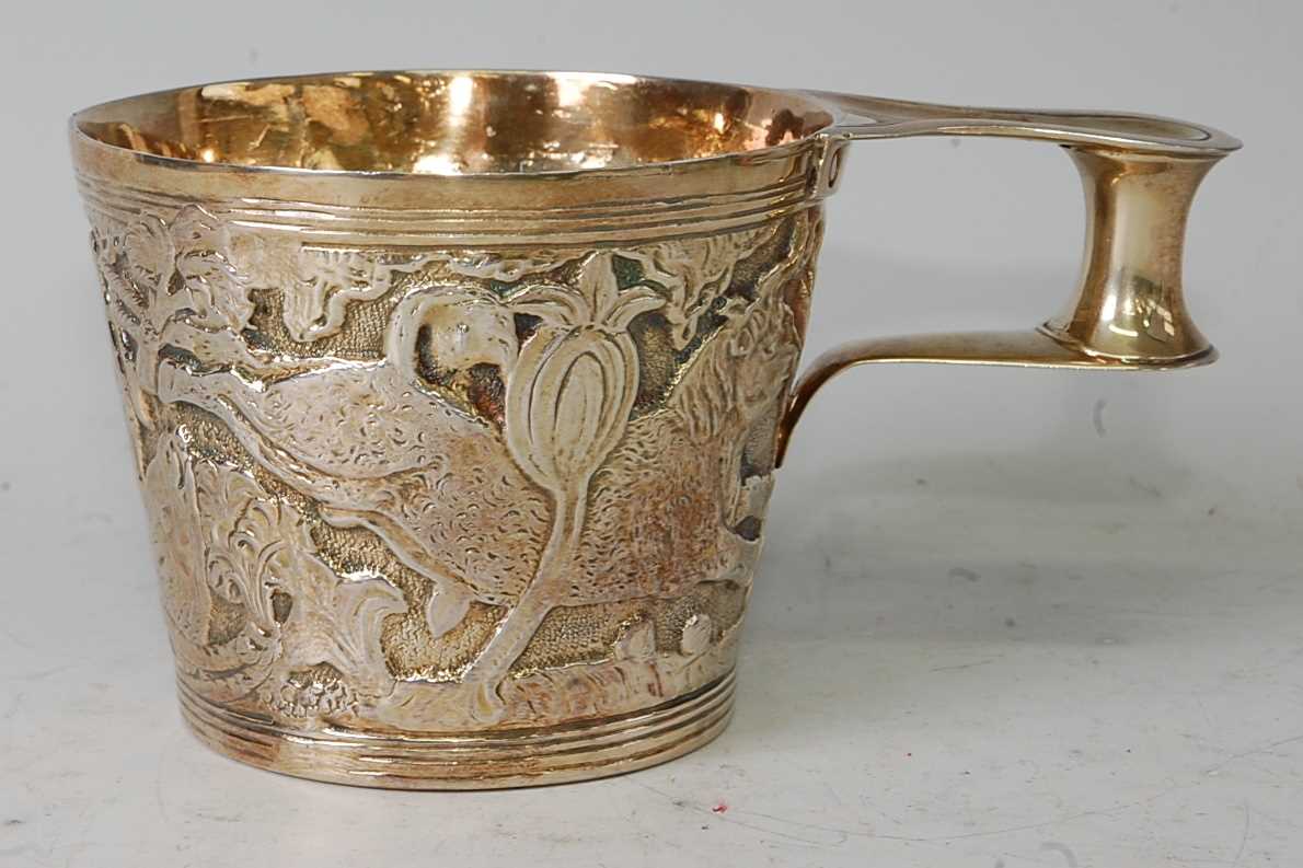 A silver gilt replica of the Vapheio Cup, with scroll and lug single handle, 10.2oz, maker