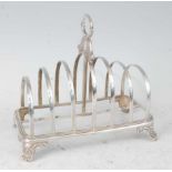 A William IV silver six-division toast rack, raised on scroll cast feet, 8oz, maker Henry