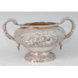 A late Georgian silver twin handled sugar, having gilt-washed interior, the exterior repousee