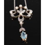 An Edwardian white metal, aquamarine, pearl and diamond openwork pendant, featuring a pear shaped