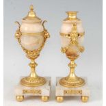 A pair of late 19th century alabaster and gilt bronze candle-holders, each modelled as a pedestal