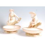 A pair of Hadley Worcester comports, each modelled as lone figure seated on a treestump, shape