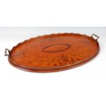 A Sheraton Revival satinwood and marquetry inlaid twin handled tray, the wavy gallery enclosing