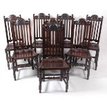 A set of eight antique joined oak dining chairs, each having a carved top rail and splat back