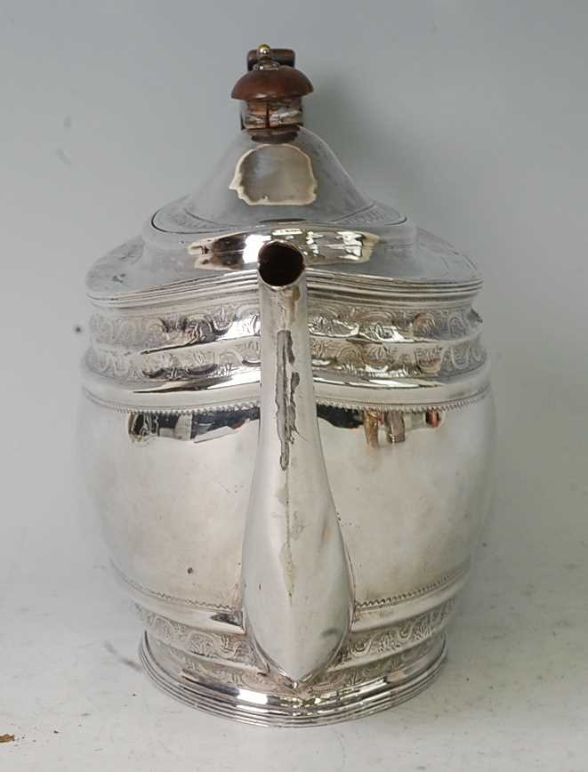 A George III silver teapot, having a finial topped hinged dome cover, bright cut engraved banded - Image 2 of 5