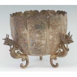A circa 1900 Hong Kong silver footed jardinière, of lobed tapering form, the panels decorated with