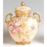 A Royal Worcester porcelain pot pourri vase and cover, decorated with wildflowers in shot enamels on