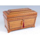 A late Victorian satinwood tea caddy, of sarcophagus form, having rosewood crossbanding, fitted