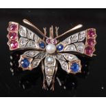 A late 19th century yellow metal multi-stone butterfly brooch, the wings set with 16 rose cut