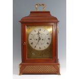 A 19th century mahogany cased bracket clock, having an unsigned silvered dial with Roman numerals