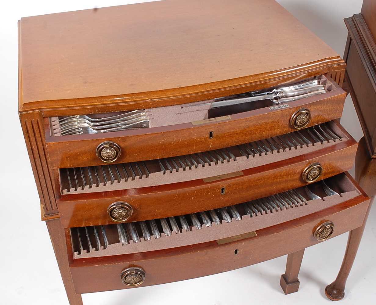 A mid-20th century Mappin & Webb mahogany three-drawer canteen table, containing a near-full - Image 2 of 9