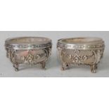 A pair of circa 1900 continental white metal table salts with frosted glass liners, each of