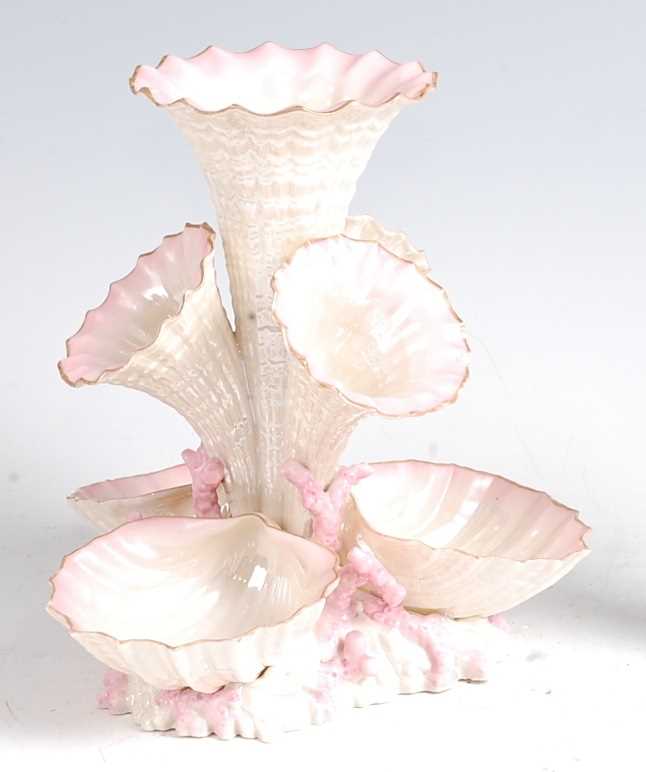 A second period Belleek porcelain Marine vase, having four trumpets over three conch-shells amidst