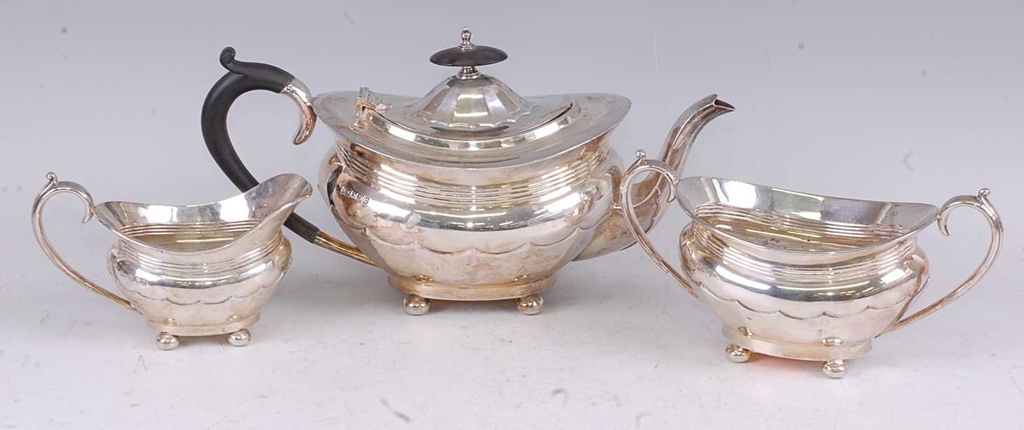 A Walker & Hall silver three-piece tea set, in the early 19th century style, each piece of oval