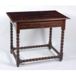 A circa 1700 joined oak side table, the three-plank top with a moulded edge over a thumb-cut frieze,