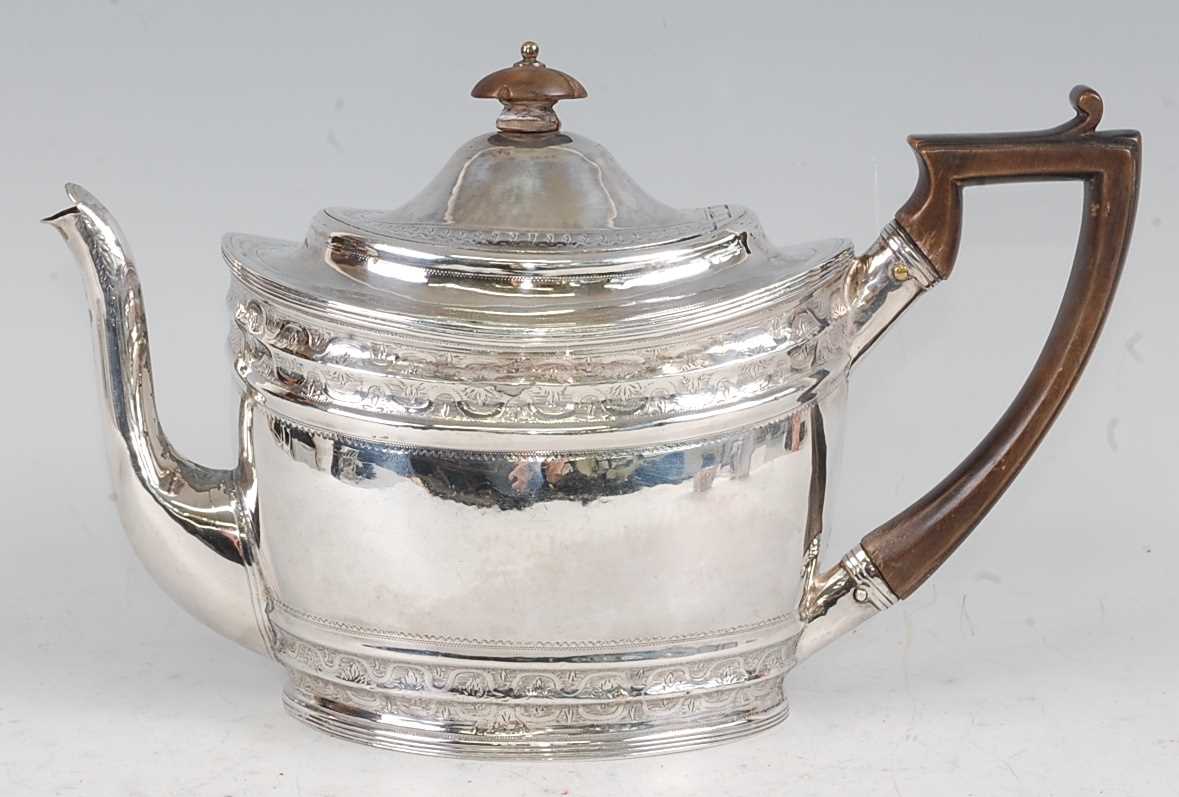 A George III silver teapot, having a finial topped hinged dome cover, bright cut engraved banded - Image 3 of 5