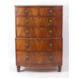 A late Regency mahogany bowfront chest-on-chest, the upper section having two short and two long