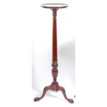 A mahogany pedestal jardinière stand, having fluted and reeded column, on hipped cabriole