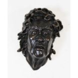 A modern bronzed metal wall mask in the form of Medusa, height 20cm