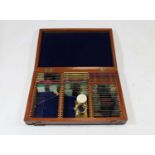 A collection of glass microscope slides in fitted mahogany case