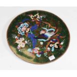 A Japanese late Meiji period shibiyama decorated panel, of oval form, the centre decorated with a