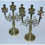 A pair of turned brass three sconce candelabra, height 42cmCondition report: Mid-20th century.Height